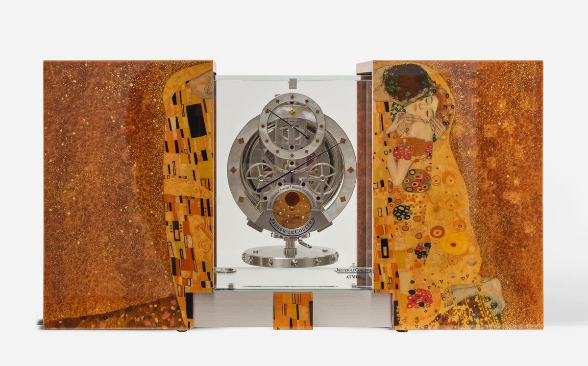 Front view of the open Jaeger-LeCoultre Atmos Marqueterie clock displaying the regulator movement and Gustav Klimt marquetry wings