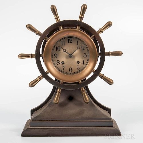 Front view of Chelsea Mariner yacht wheel ship's bell clock on mahogany base