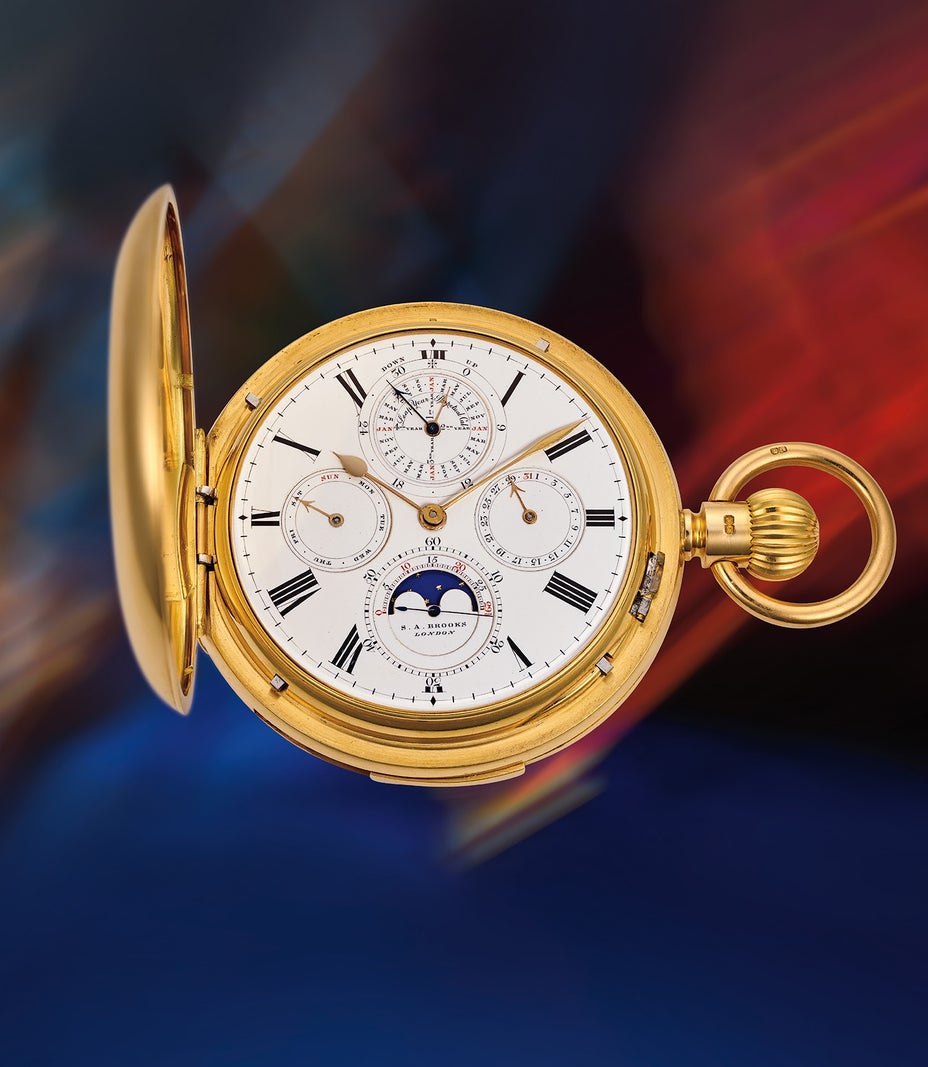 Front view of the hunter-cased pocket watch showing the white enamel dial with calendar and moon phase indications