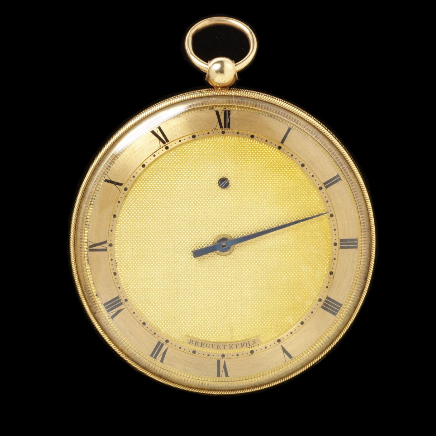 Front view of the gold pocket watch featuring an engine-turned dial.
