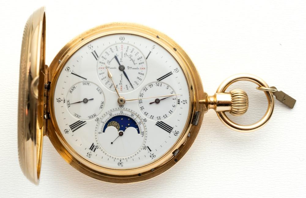 Front view of the Ls. Audemars perpetual calendar pocket watch with hunter-style lid open to reveal the calendar complications.