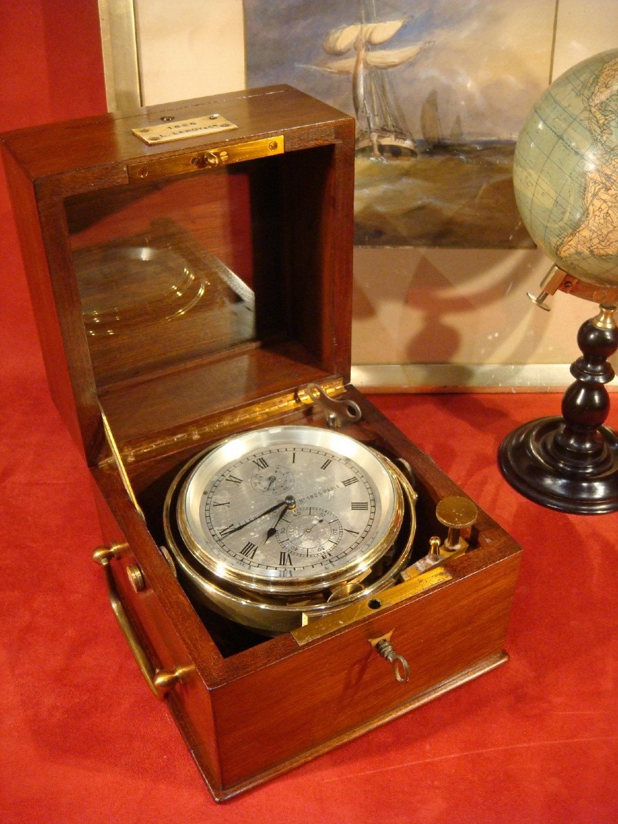 Three-quarter view of the Leroy marine chronometer in its opened mahogany box with brass gimbal and glazed inner lid