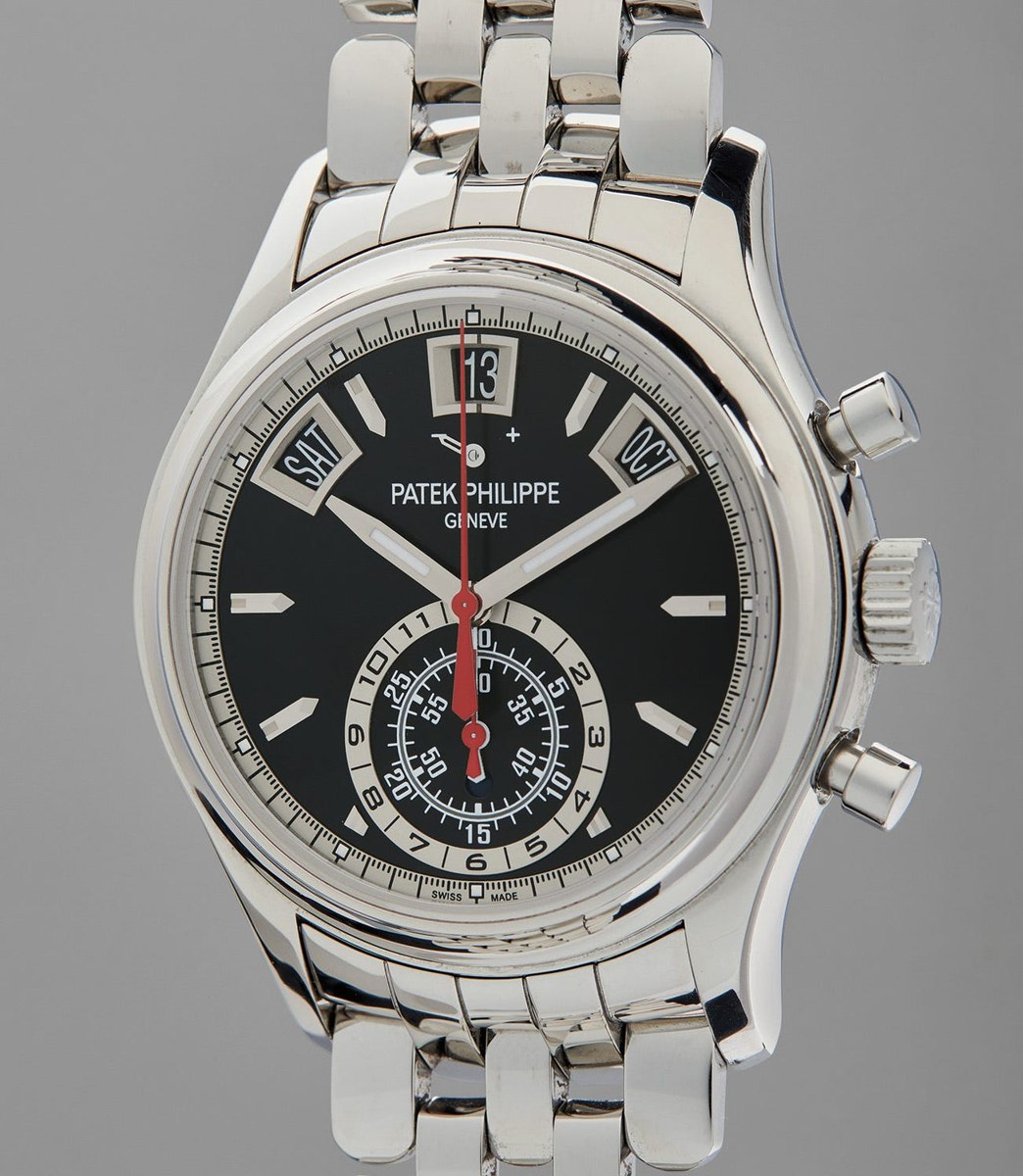 Front view of the Patek Philippe Ref. 59601A-010 showing black dial, annual calendar apertures, chronograph display, and steel bracelet