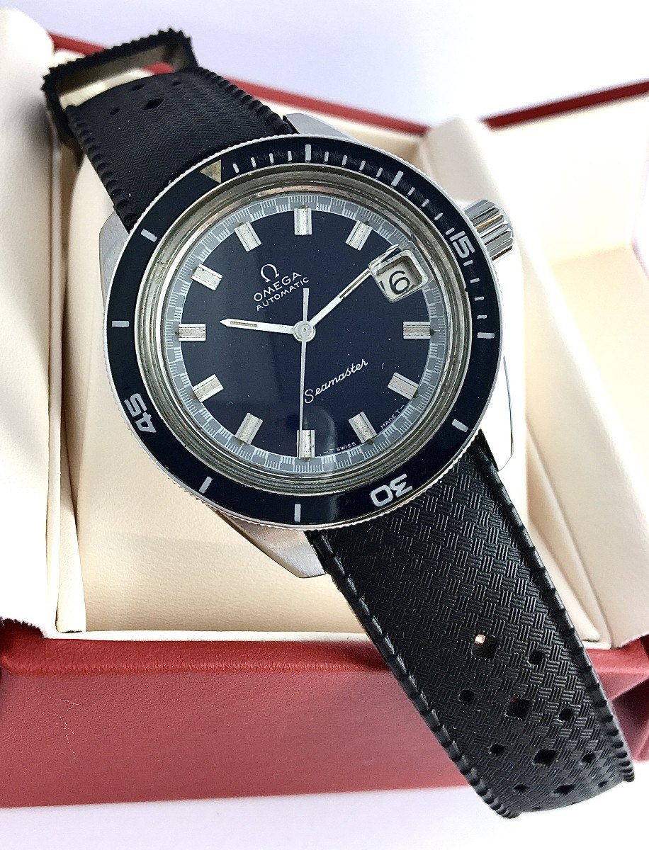 Front three-quarter view of the Omega Seamaster Big Crown ref. 166.062 resting in a red presentation box