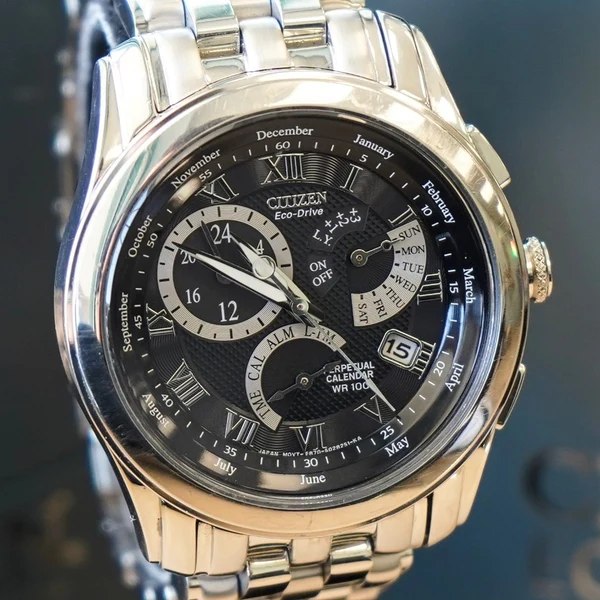 Front view of the Citizen Eco-Drive wristwatch showing the black multi-subdial layout and steel bracelet