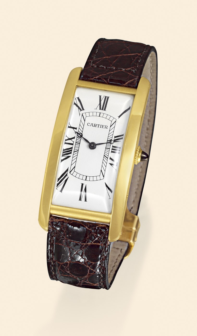 Front view of the Cartier Grande Tank showing the silver dial and 18K yellow gold case.