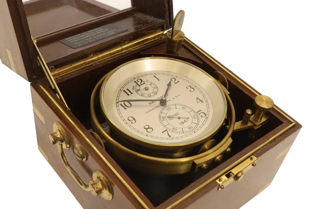 Hamilton mahogany two-day marine chronometer with gimbal mount, plaque, and winding key