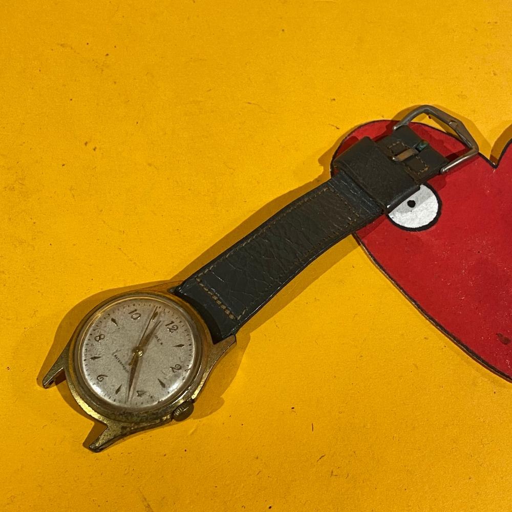 Dial and case front view of the Timex watch with upper strap attached