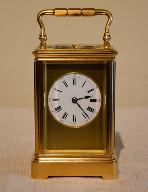 Front view of the Henri Jacot striking carriage clock in a corniche case