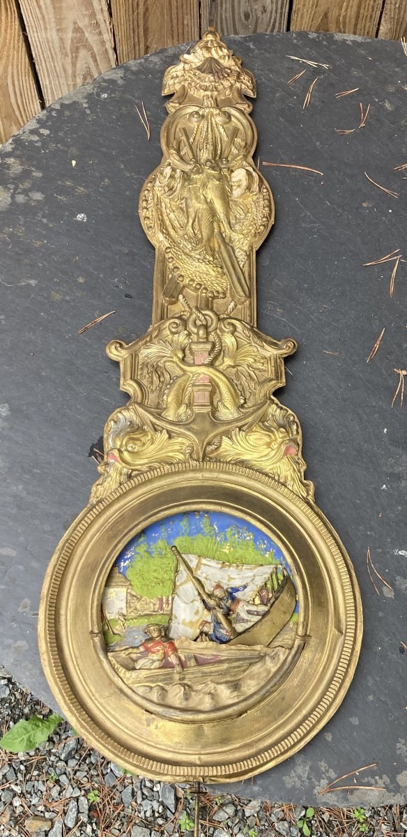 Full view of the brass animated Comtoise pendulum showing the decorated stem and maritime scene bob