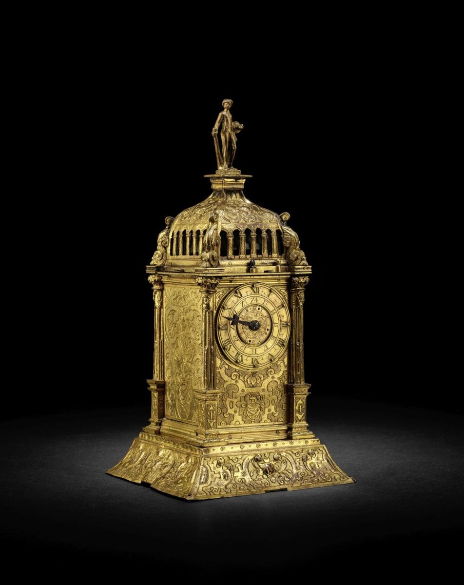 Three-quarter front view of the gilt and engraved brass Augsburg tower clock