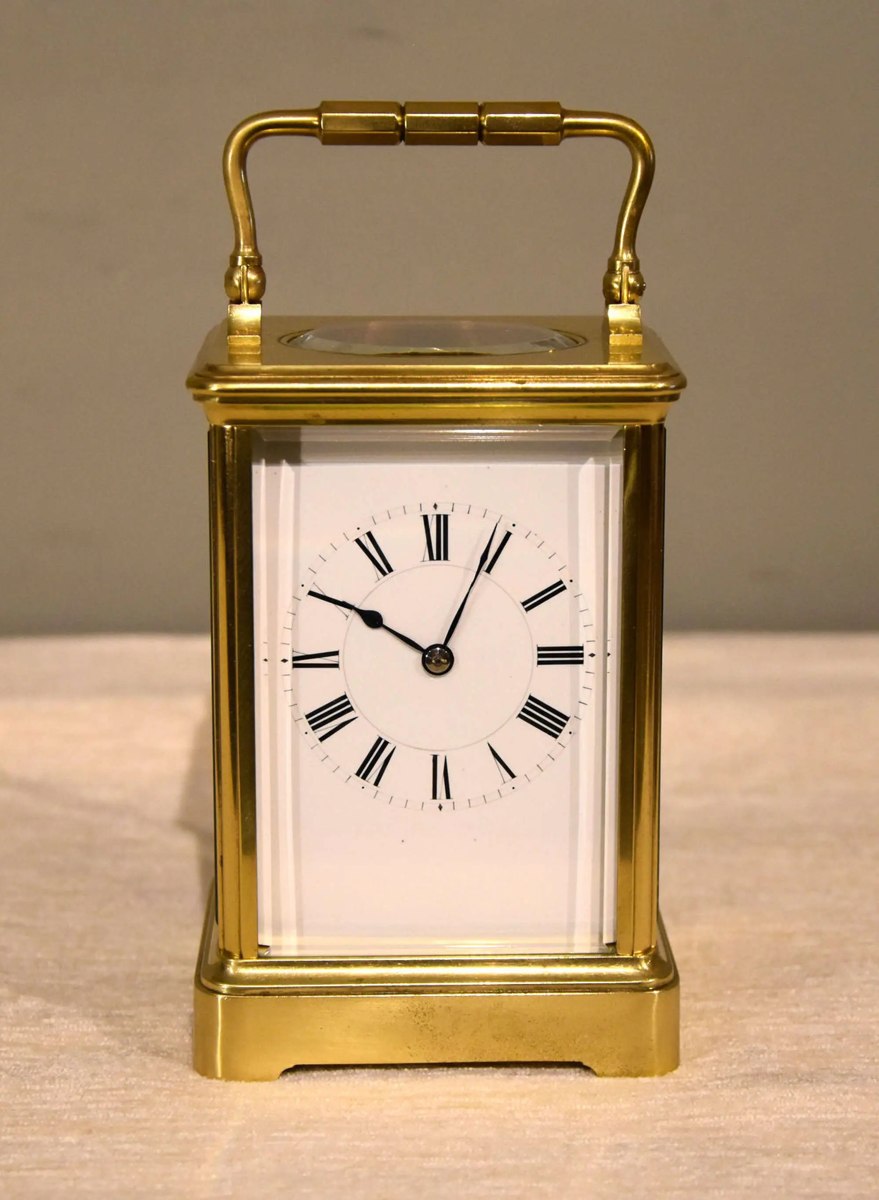 Front view of the Henri Jacot carriage timepiece in a brass corniche case