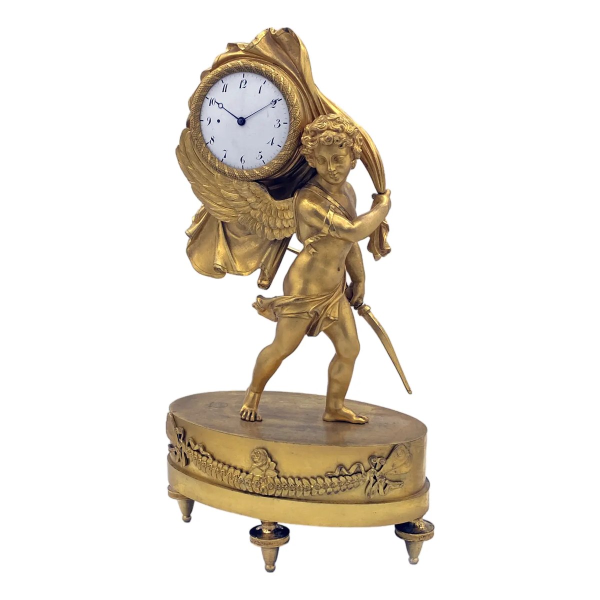 Front three-quarter view of the gilded bronze miniature clock with Cupid carrying Time