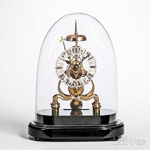 Front view of the scroll-plate skeleton clock under a glass dome on an oval ebonized base