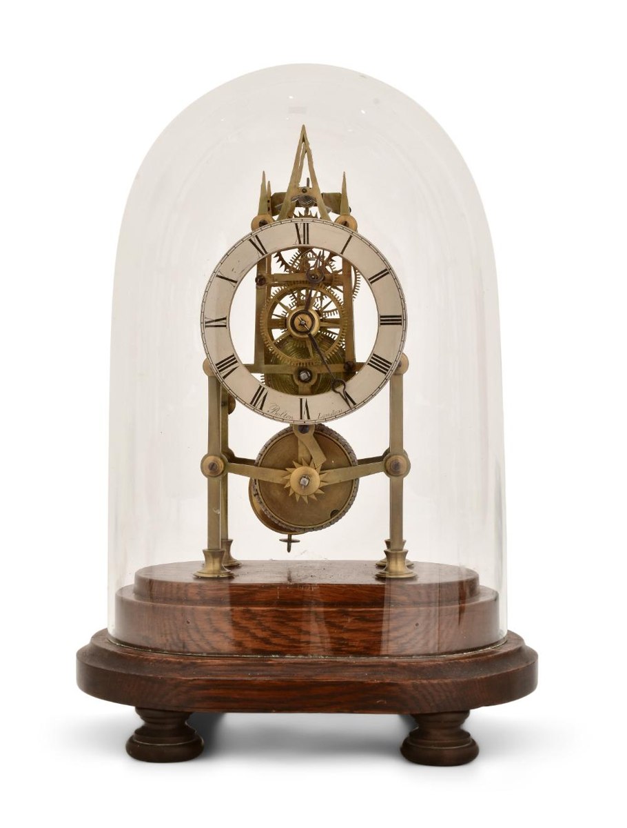 Front view of English single fusee skeleton clock signed Bolton-London on stepped wooden base under glass dome