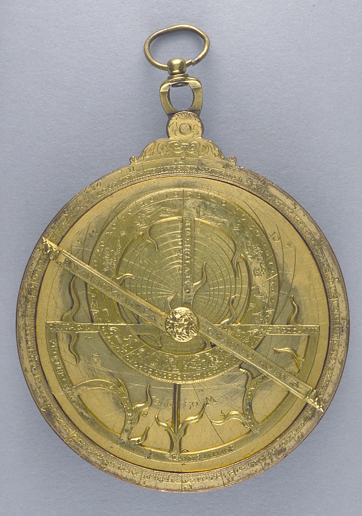 Front view of the gilt brass astrolabe showing the rete, rule, and alidade.