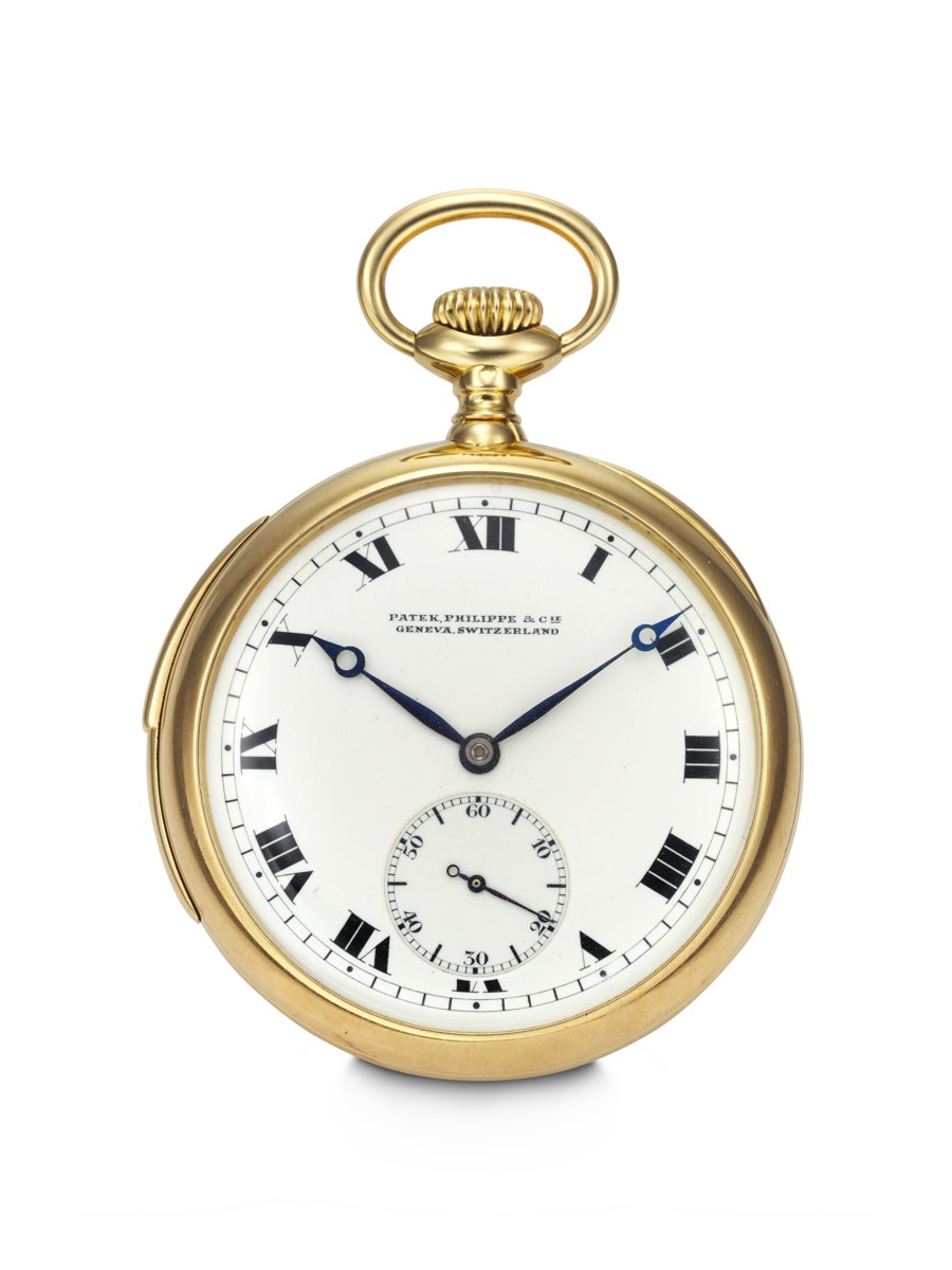 Front view of the Patek Philippe open-face pocket watch showing the white enamel dial and yellow gold case