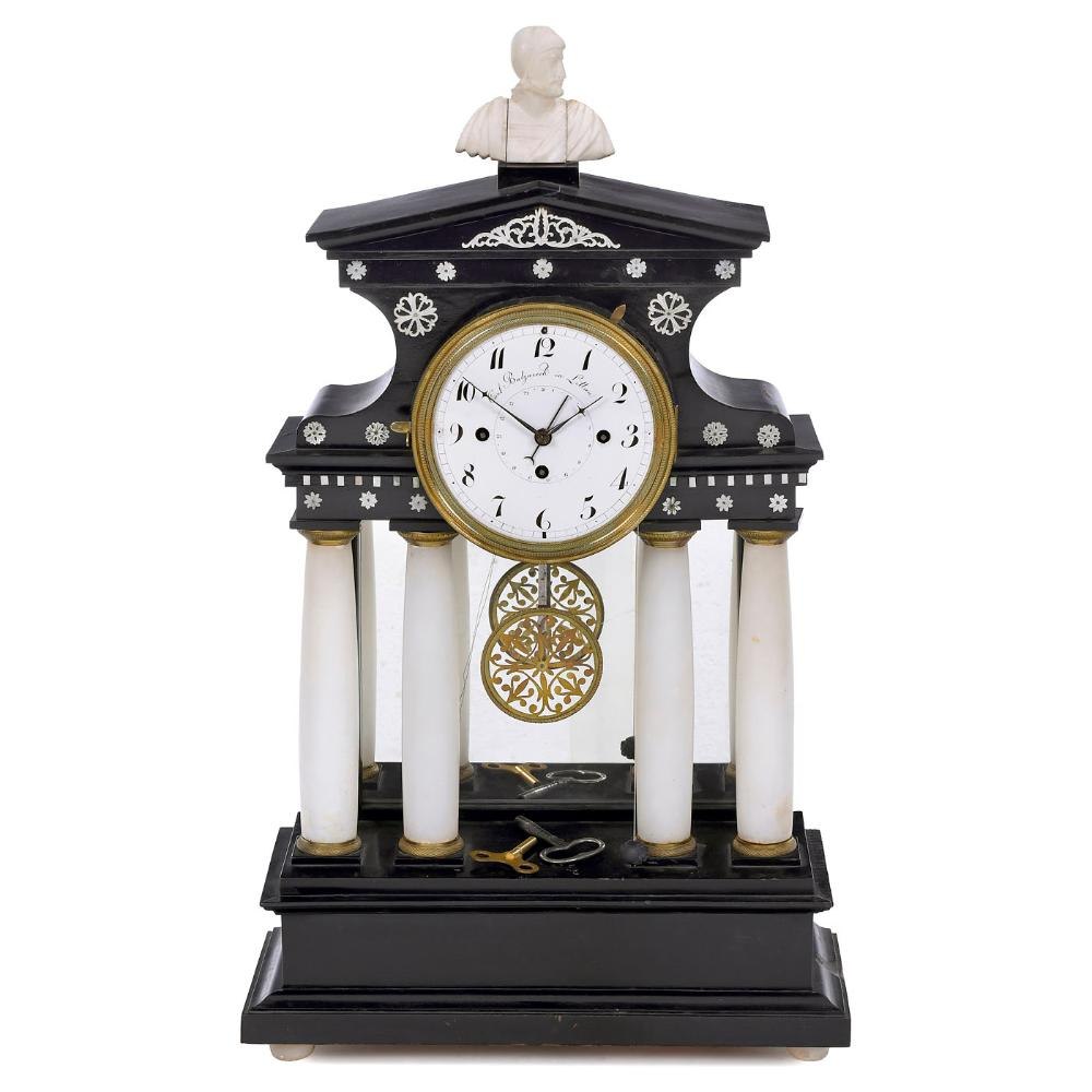 Front view of the portal clock showing the enamel dial, alabaster columns, and ebonized case.