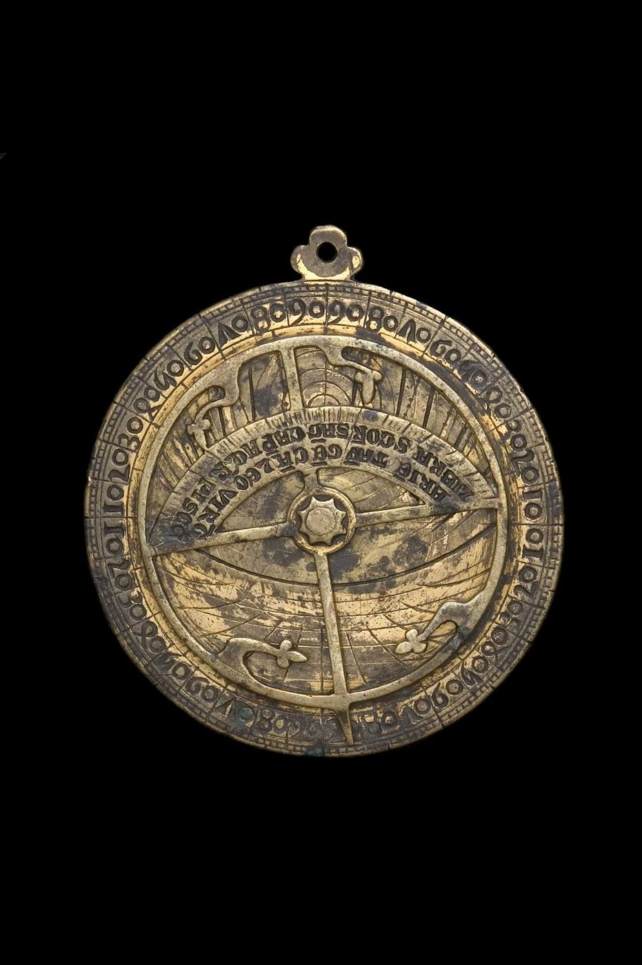 Front view of the astrolabe showing the rete, the star-shaped rivet, and the degree scale on the limb.