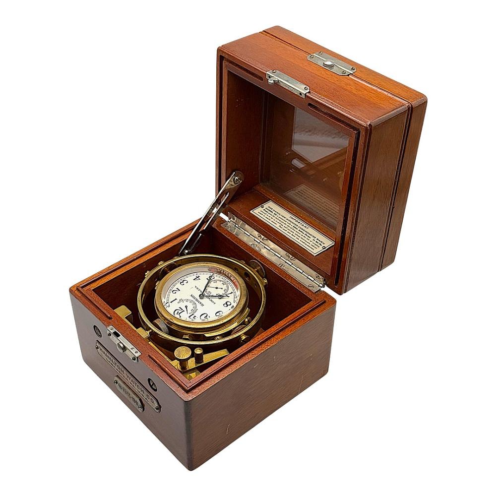 Hamilton Watch Co. Model 22 marine chronometer No. 7943 in a three-tiered mahogany box.