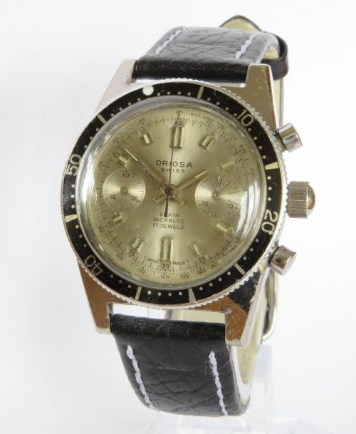 Three-quarter front view of the Oriosa chronograph wristwatch mounted on a display stand
