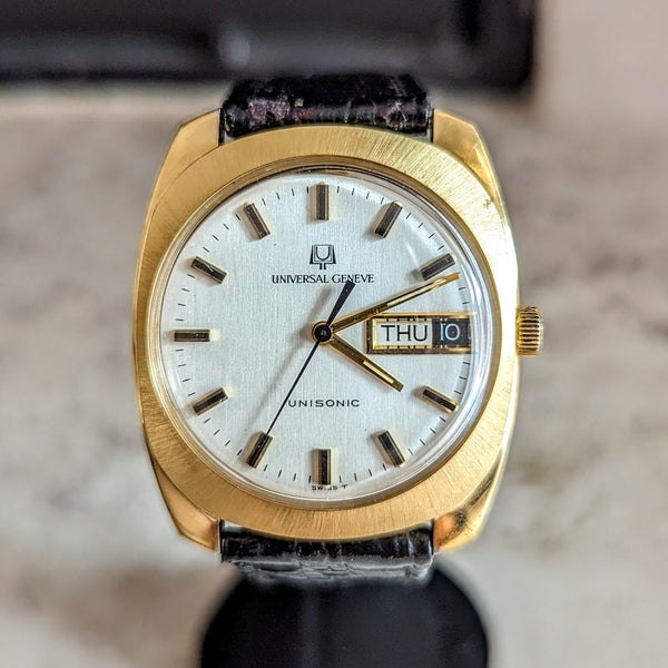Front view of the Universal Genève Unisonic wristwatch showing dial, day-date window, and brushed bezel