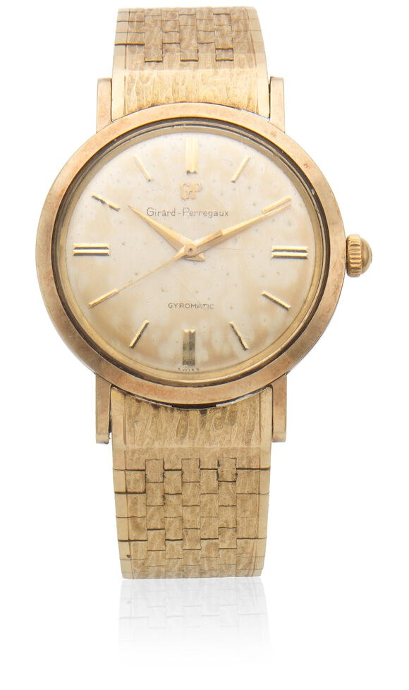 Front view of the Girard-Perregaux Gyromatic watch with champagne dial and textured gold bracelet