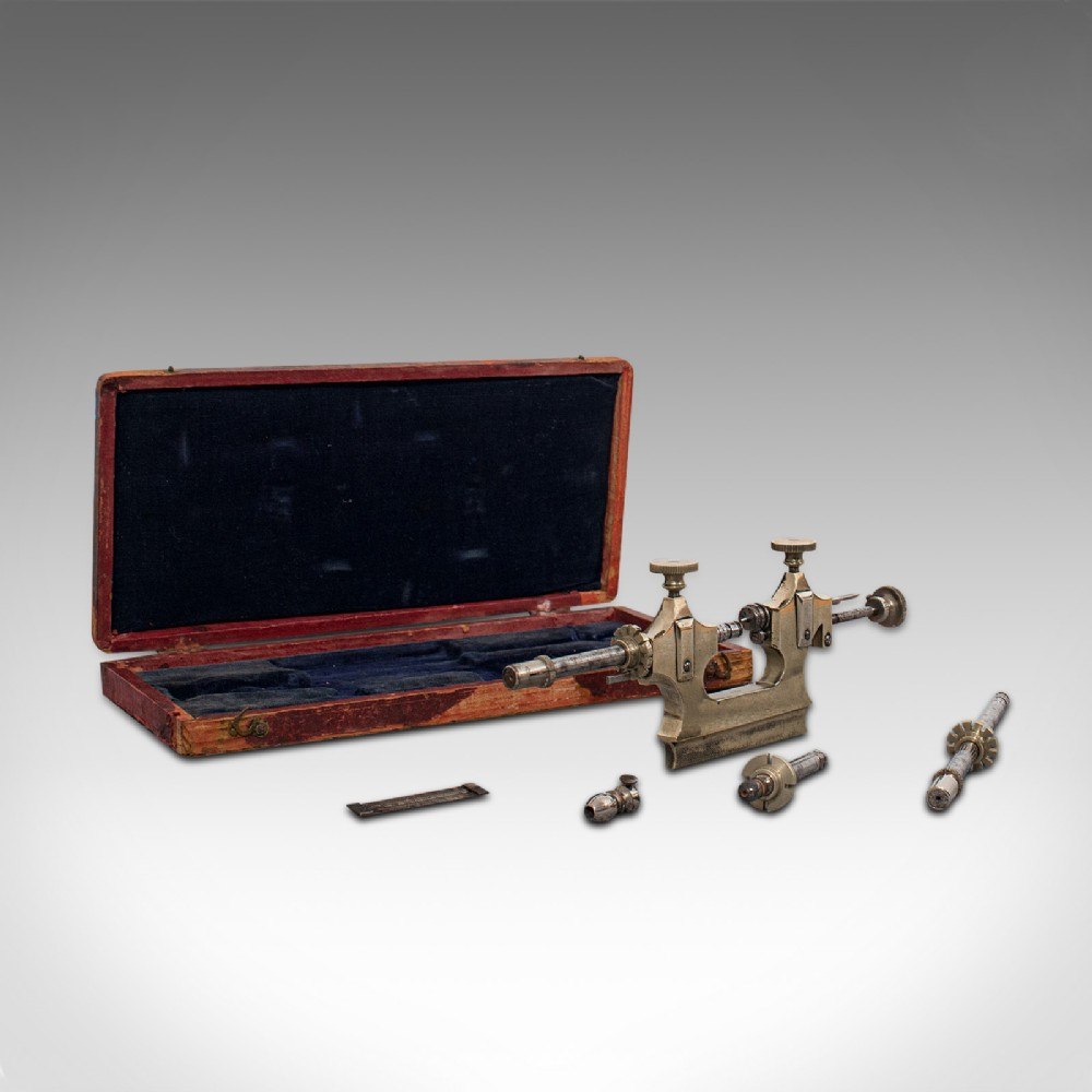 Swiss brass and steel Jacot lathe displayed with fitted velvet-lined case and accessory parts