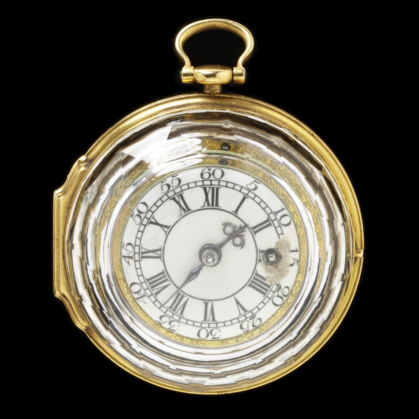 Front view of the gold and crystal watch with the dial exposed.