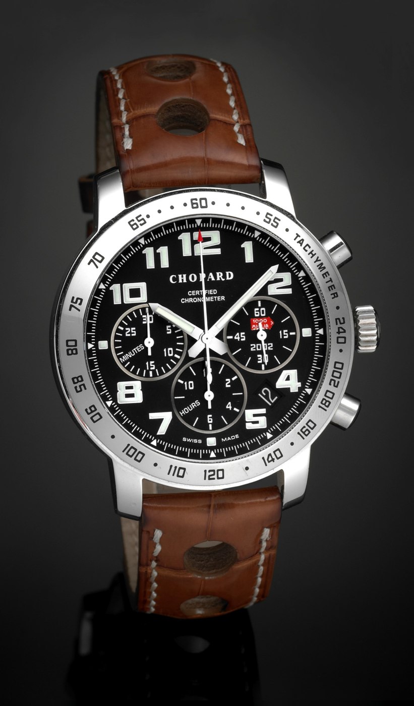 Front view of the Chopard Mille Miglia Brescia-Rome Classic car race steel chronograph wristwatch, showing the black dial with subsidiary registers, tachometer bezel, and perforated brown leather strap.