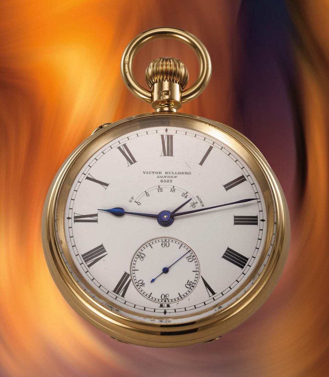 Front view of the Victor Kullberg pocket chronometer showing the white dial, power reserve indicator, and yellow gold case