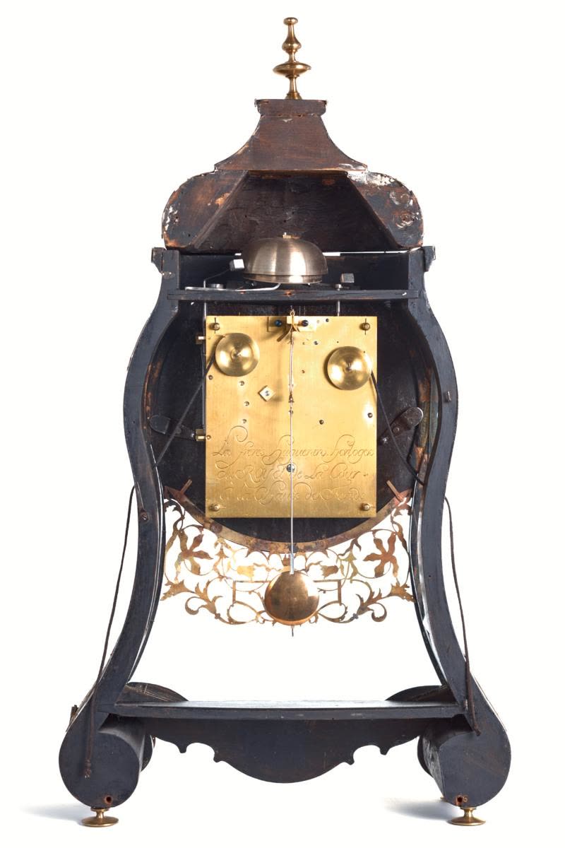 The curved, black painted wooden case is decorated with engraved and pierced brass appliques featuring interlaced scrollwork and tulips (MIH IV-413)