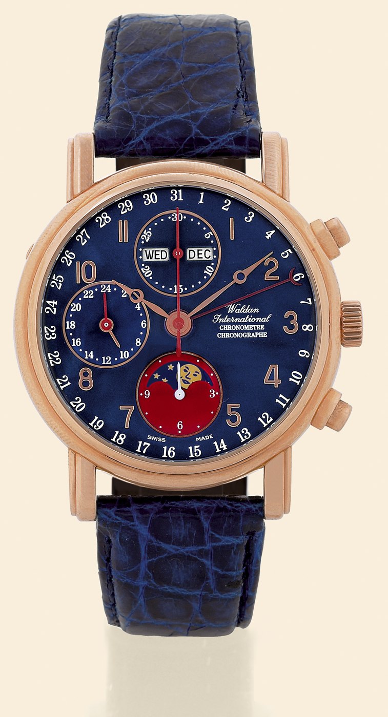 Front view of the Waldan International Chronometer Chronograph, showing the blue dial, moon phase indicator, and pink gold case.