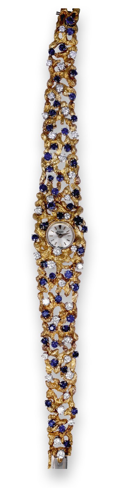 The Piaget 18K yellow gold, diamond and sapphire-set lady's bracelet watch, featuring an integrated textured rocaille bracelet.