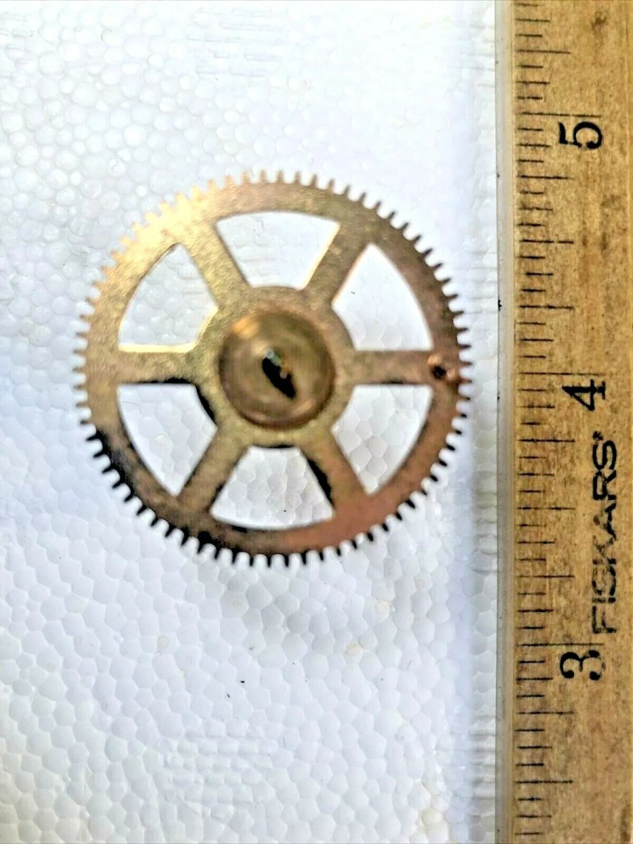 Waterbury clock warning wheel displayed beside a ruler