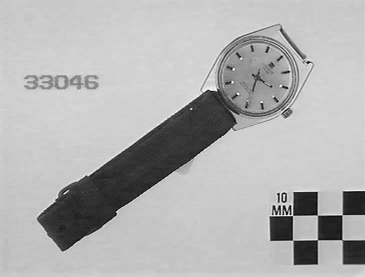 Tissot Astrolon wristwatch shown with a fabric strap, registered as ST 33046.