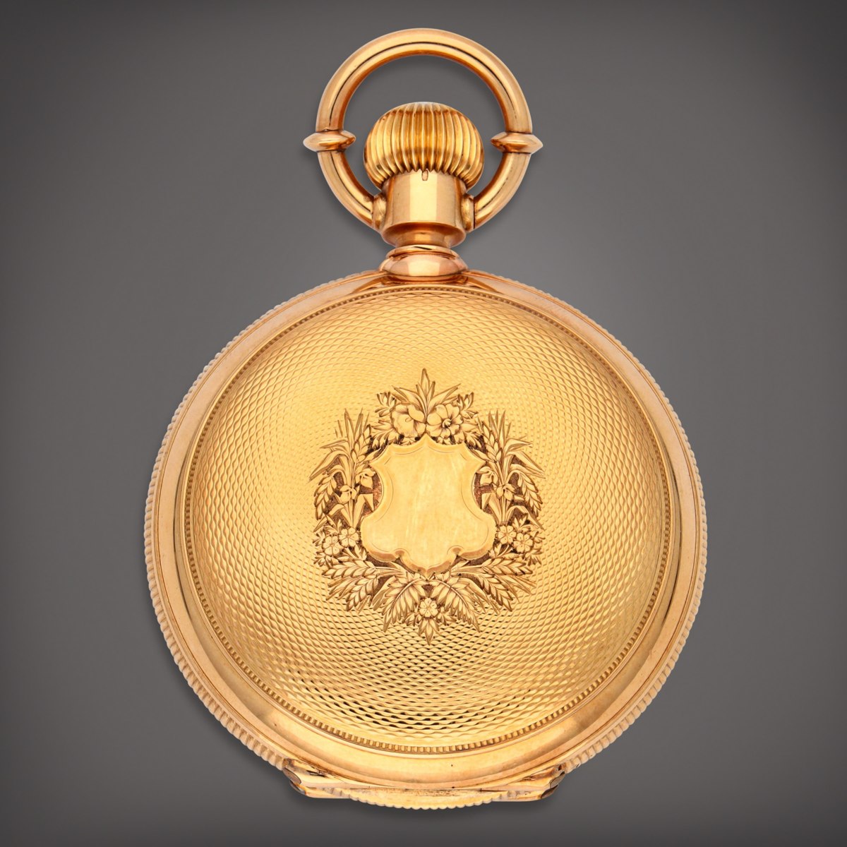 Engine-turned yellow gold front lid of the Girard-Perregaux hunting cased pocket watch with floral cartouche