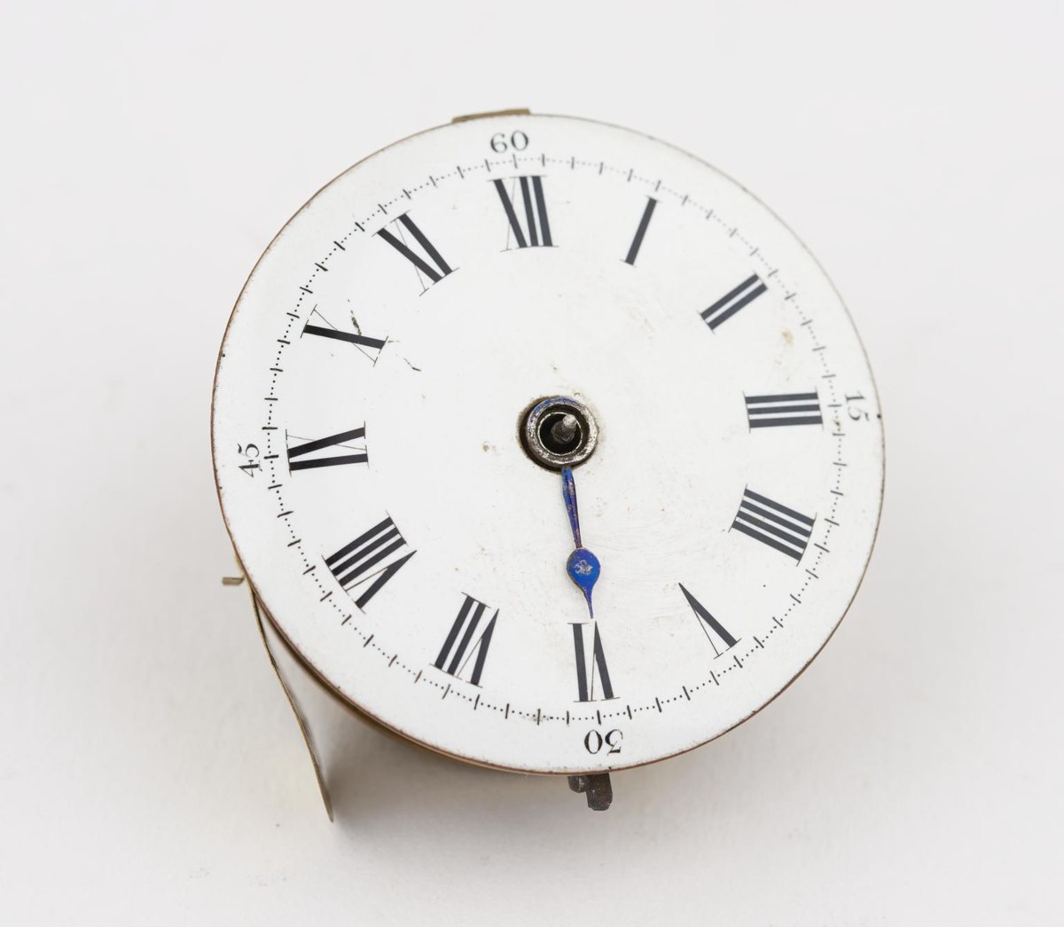 Dial view of pocket watch movement 1920-551 showing white enamel dial and single blued steel hand