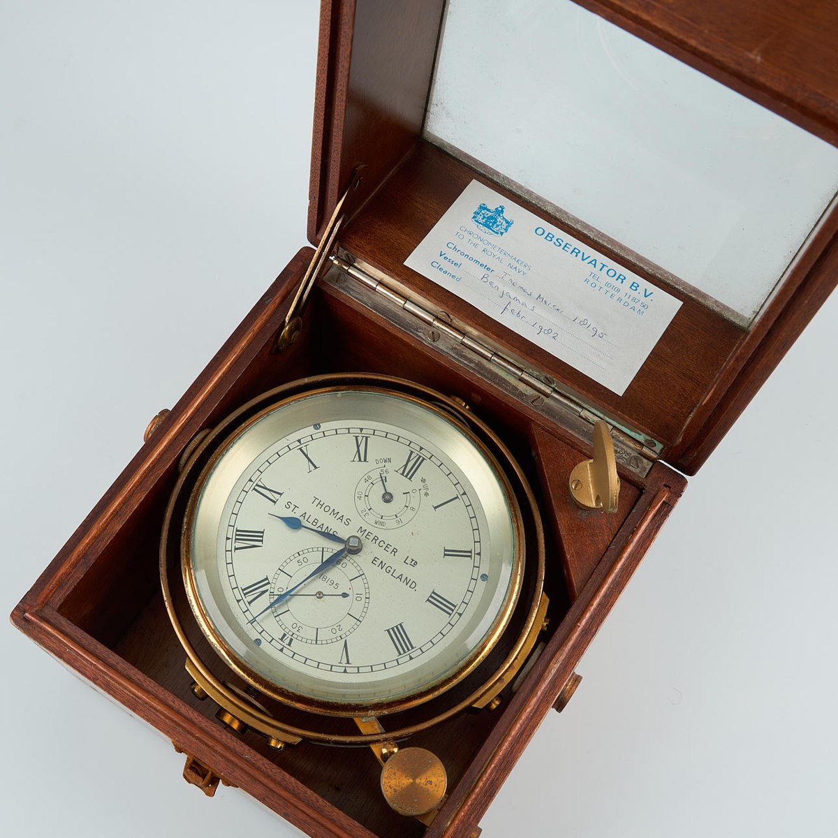 Dial and gimbal mount of Thomas Mercer marine chronometer No. 18195 in open mahogany case