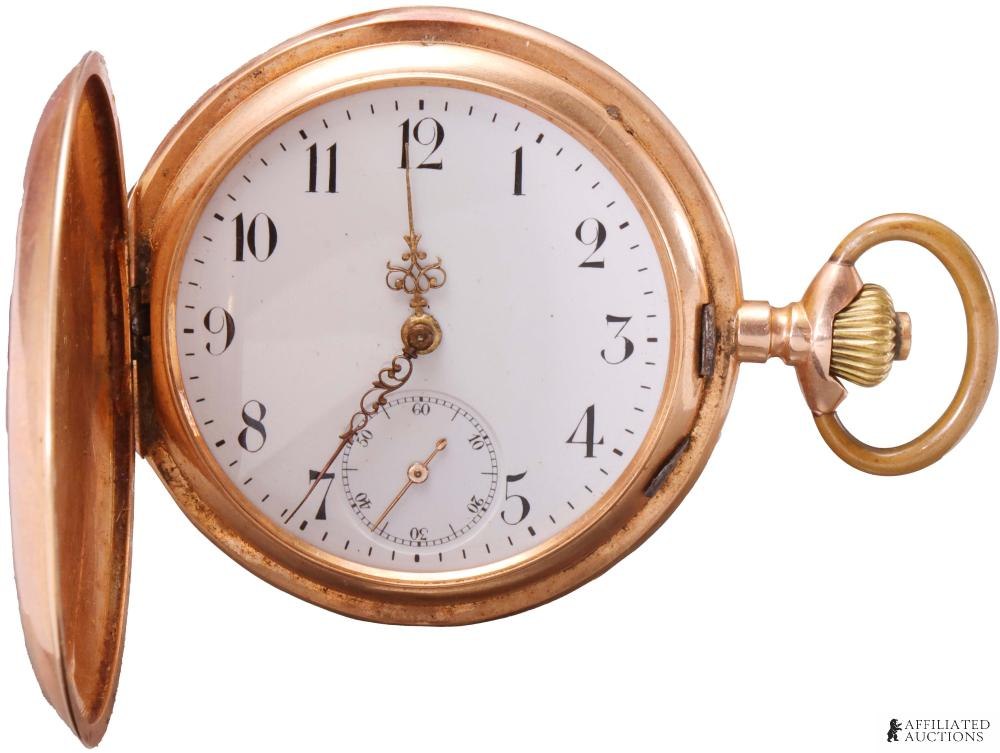 Front view of open hunter case showing white enamel dial and gilt baroque hands
