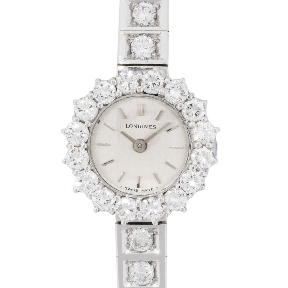 Front view of Longines 18K white gold diamond-set jewelry watch dial, bezel, and initial bracelet links