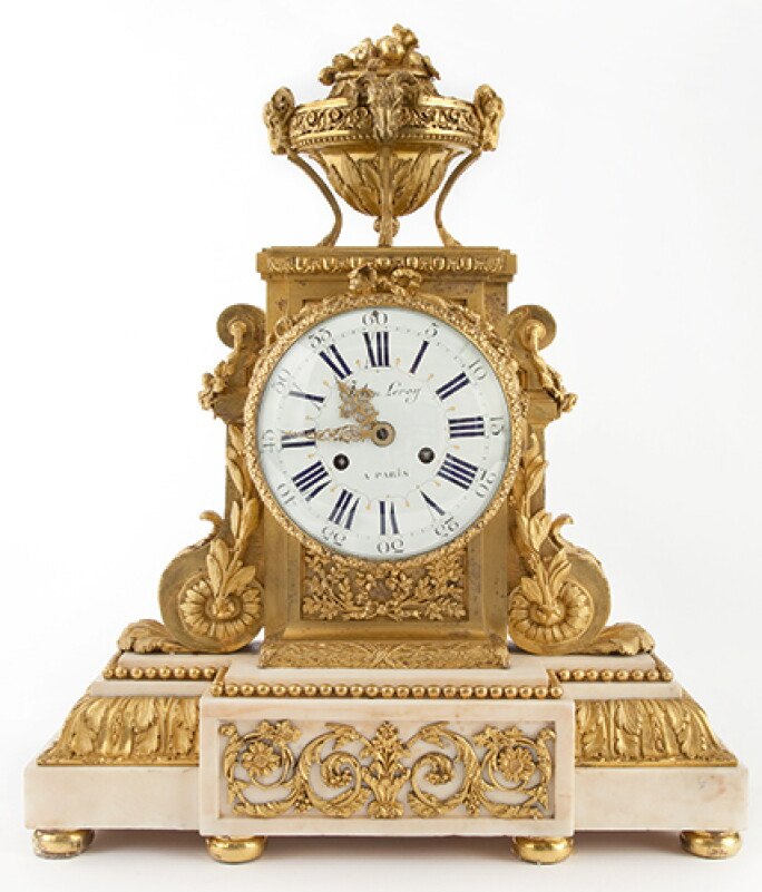 Full front view of the Louis XVI ormolu and white marble mantel clock