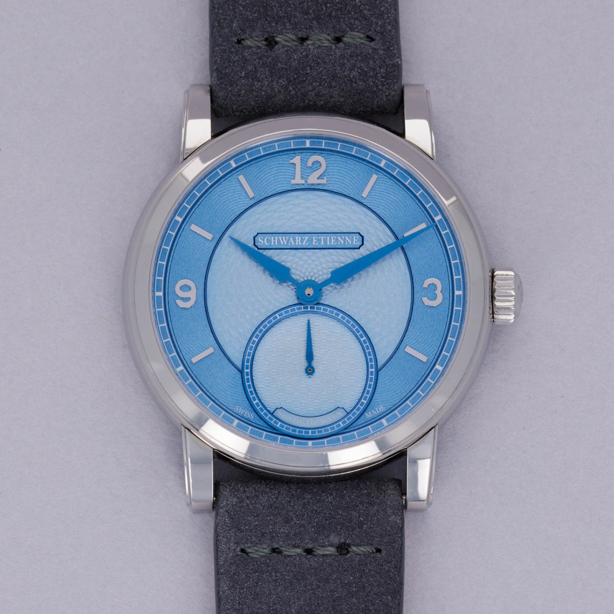 Front view of the Schwarz Etienne Roma Synergy piece unique showing the light blue guilloché dial and stainless steel case