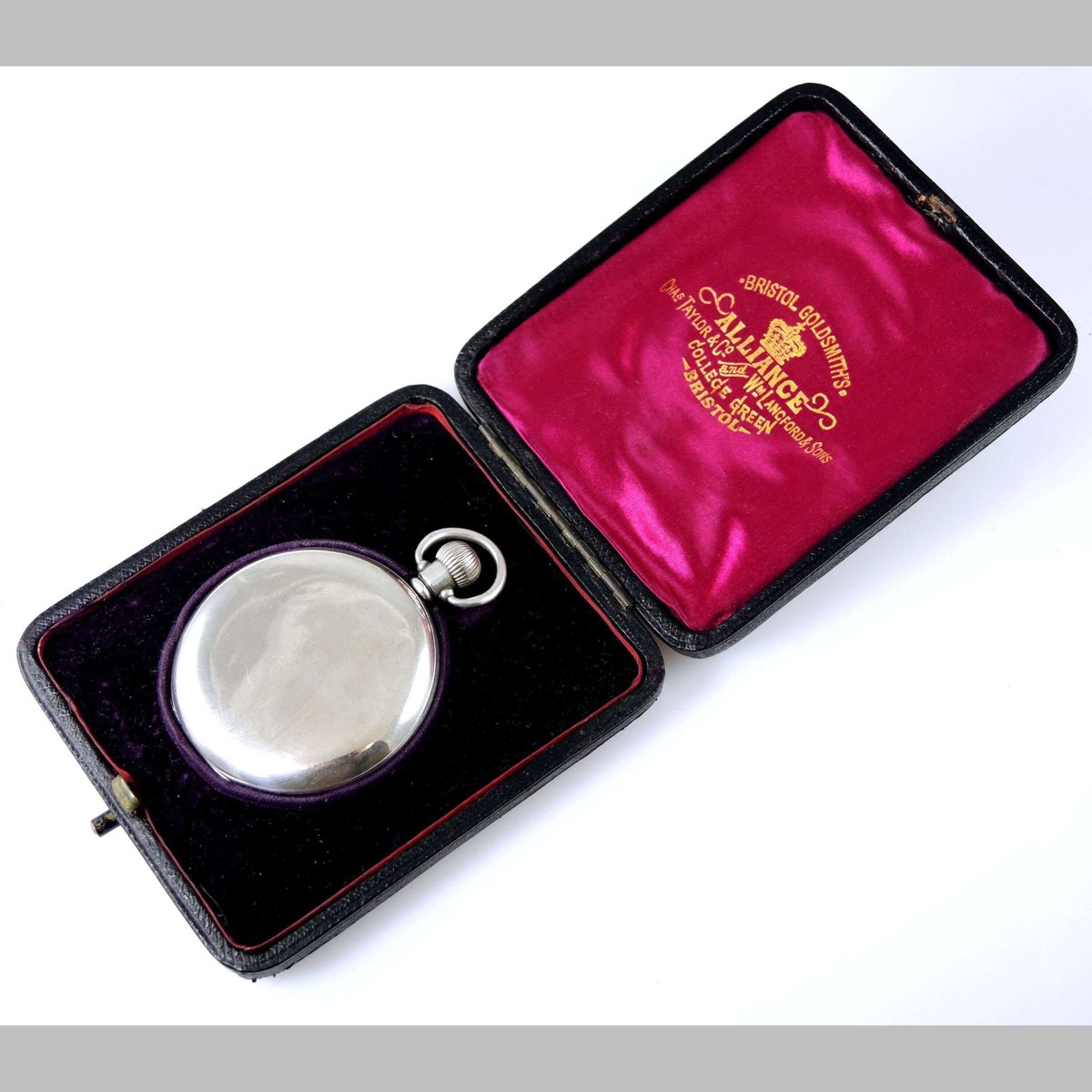 Closed Dennison silver full hunter pocket watch resting in its fitted Bristol Goldsmiths' Alliance presentation case
