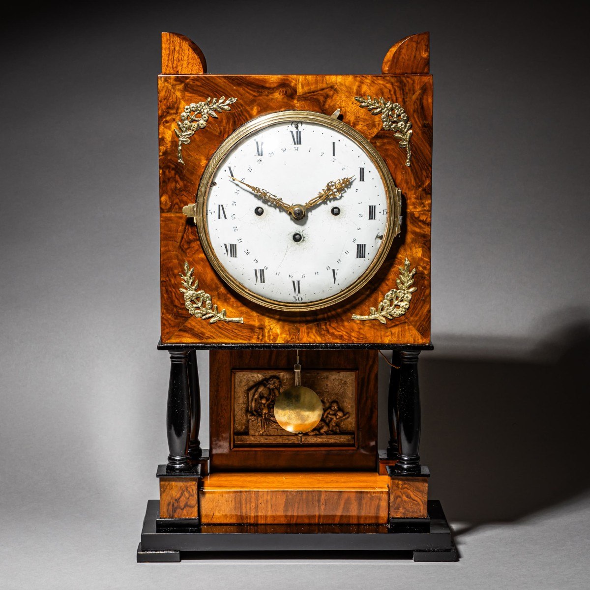 Frontal view of the Viennese Empire-style walnut and ebonized table clock