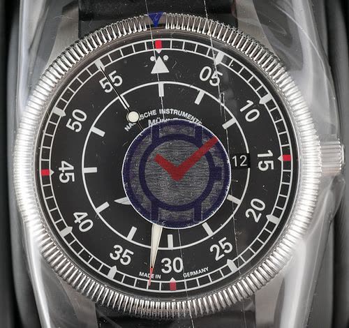 Dial and bezel of the Mühle-Glashütte AOPA AeroSport 80th Anniversary wristwatch enclosed in protective plastic