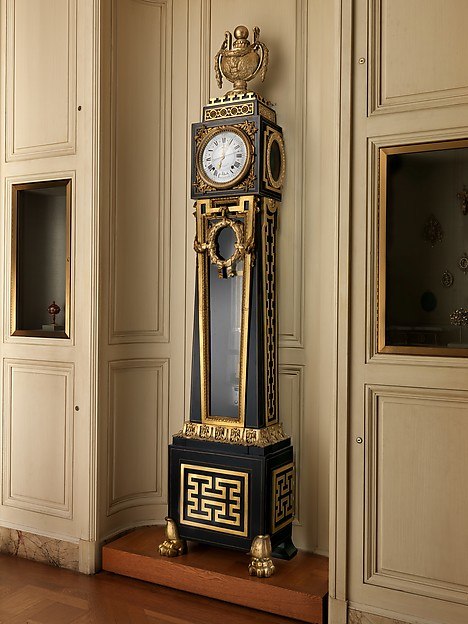 Full-length view of the longcase astronomical regulator in its gallery setting.