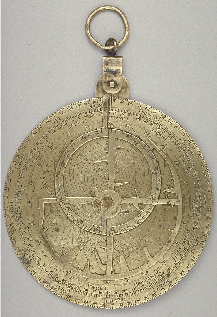 The obverse of the 1507 brass astrolabe signed by Falcono, displaying the zodiacal and calendrical scales, almucantars, and the damaged rete.
