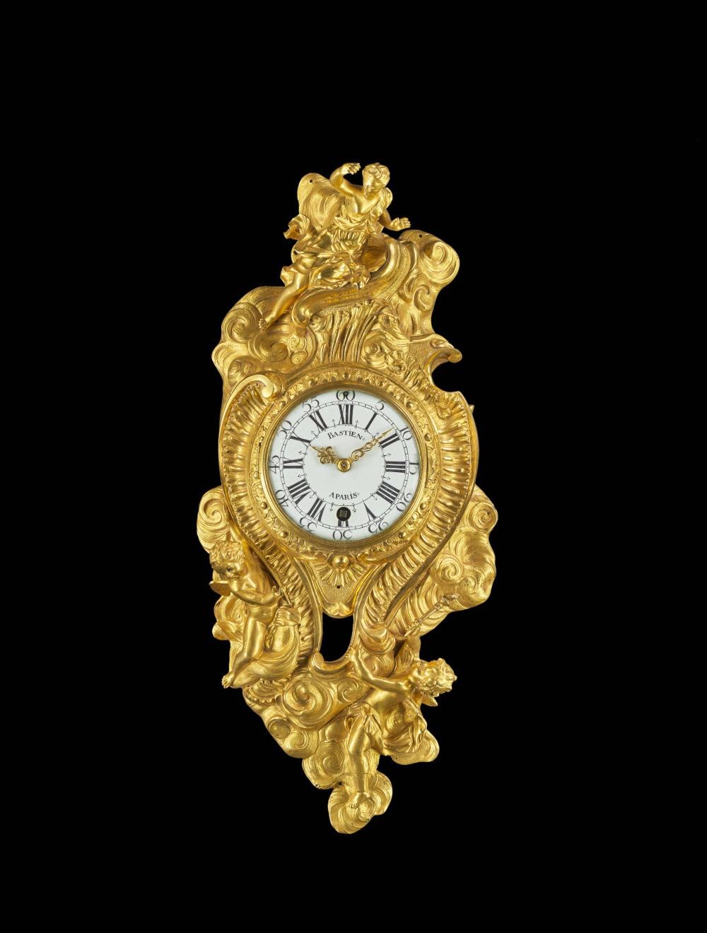 Front view of the Bastien gilt-bronze cartel d'applique clock.