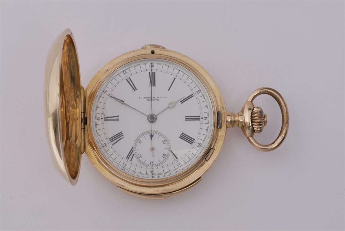 Open view of the J. Barth & Fils 14k gold hunter pocket watch showing the white dial and side controls